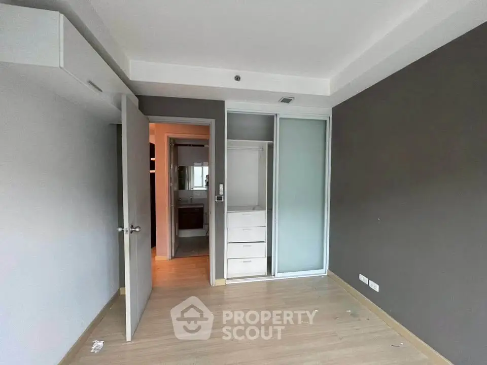Spacious bedroom with built-in closet and modern design