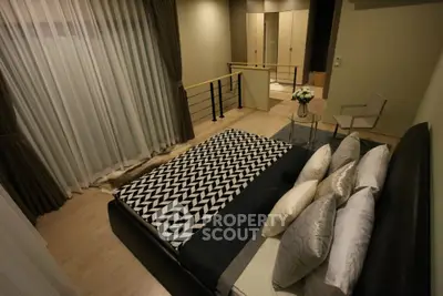 Luxurious bedroom with stylish decor and modern furnishings, featuring a cozy bed and elegant lighting.