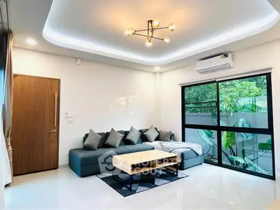 Modern living room with stylish lighting and large window view