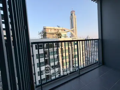Modern balcony with cityscape view in high-rise apartment