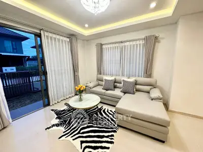 Elegant living room with modern decor and large windows for natural light.