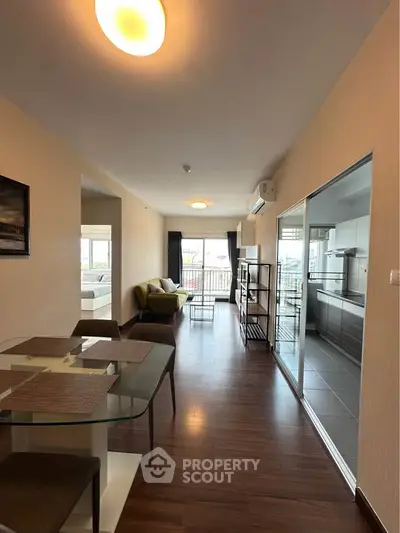 Spacious modern apartment with open layout, featuring a stylish kitchen and cozy living area, perfect for urban living.