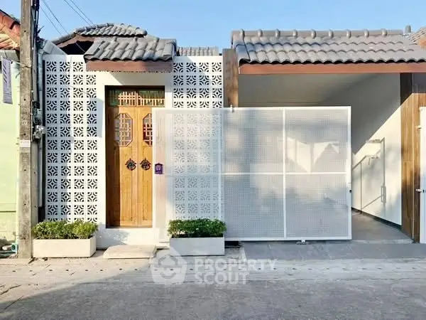 Charming modern facade with decorative brickwork and wooden door