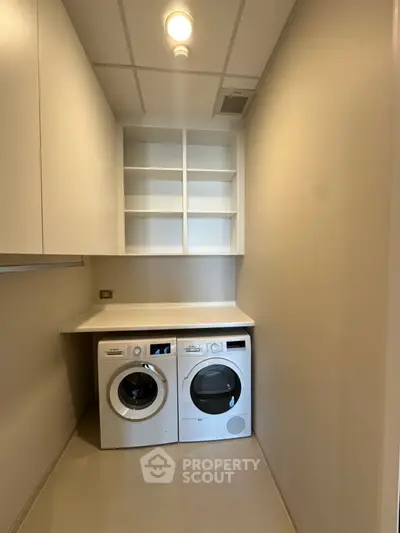 Modern laundry room with washer and dryer in sleek minimalist design