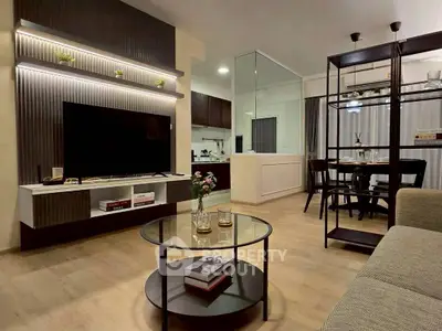 Modern living room with open kitchen and stylish decor