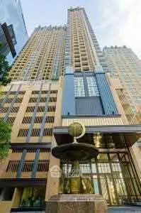 Stunning high-rise building with modern architectural design and elegant entrance