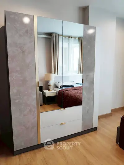 Modern bedroom with stylish wardrobe and elegant decor