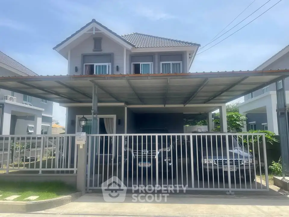 Charming two-story house with covered parking and modern design in a serene neighborhood.