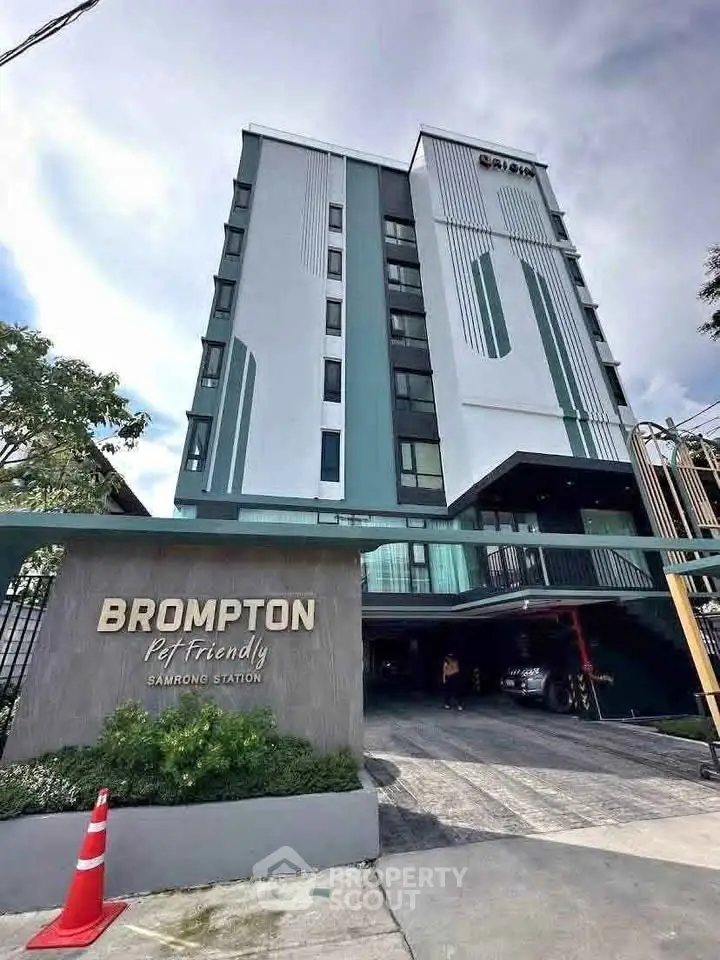 Modern pet-friendly condominium building with stylish facade near Samrong Station.