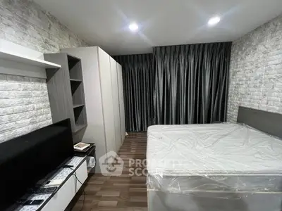 Modern bedroom with stylish decor and ample storage space