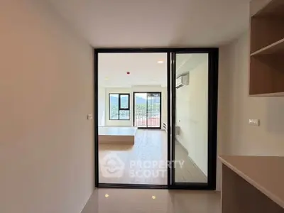 Modern apartment interior with open layout and balcony view