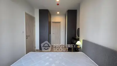 Modern bedroom with minimalist design and cozy lighting