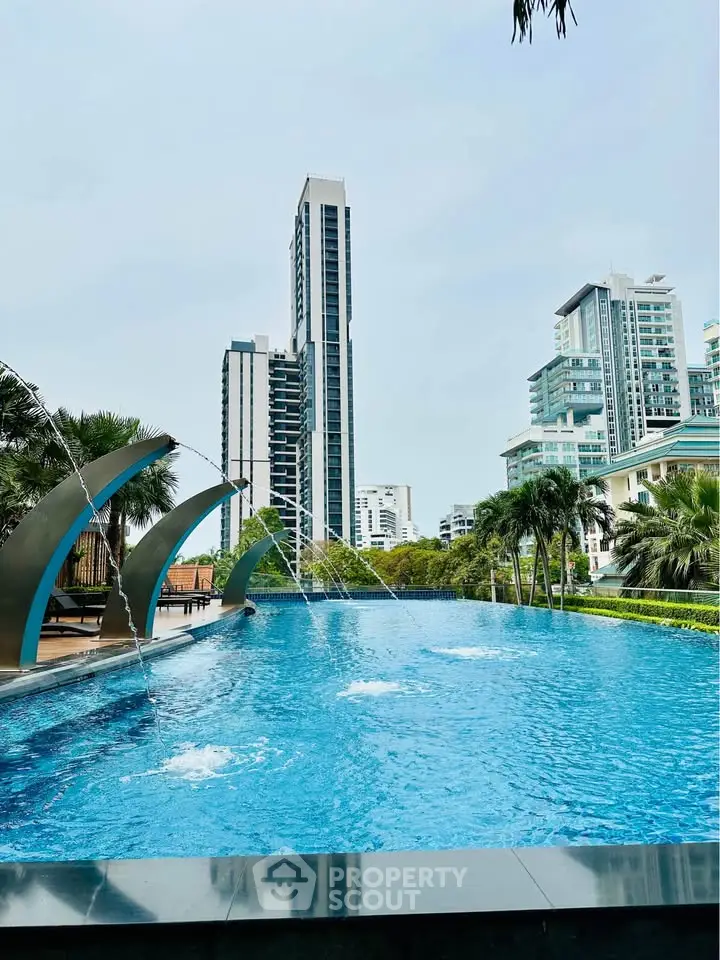 Luxurious high-rise apartment with stunning pool and city skyline view.
