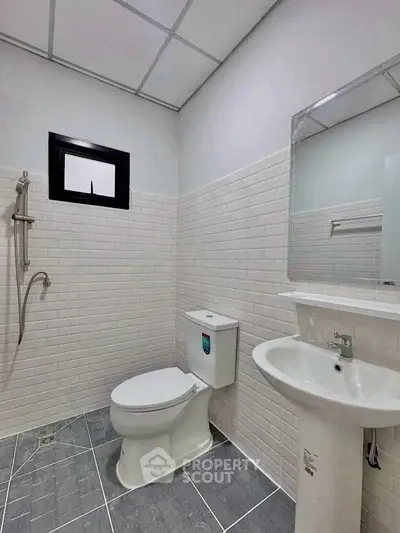 Modern bathroom with sleek fixtures and white subway tiles