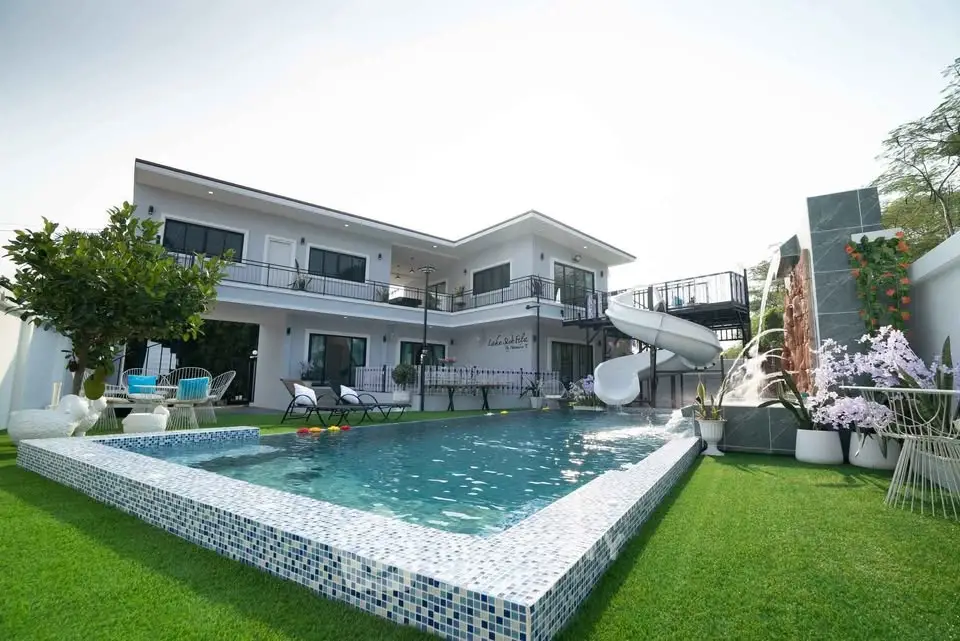 Luxurious modern villa with private pool and lush garden, perfect for relaxation and entertainment.