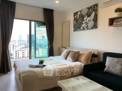 Modern bedroom with city view, cozy decor, and stylish furnishings.