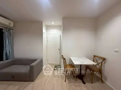 Cozy living room with modern furniture and dining area