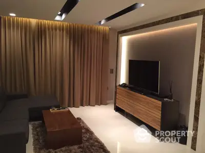 Modern living room with sleek TV setup and elegant lighting