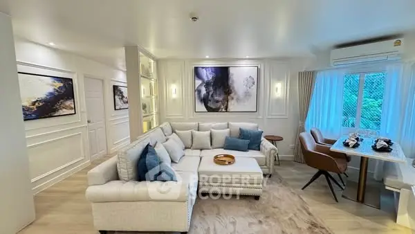Elegant living room with modern decor and natural light