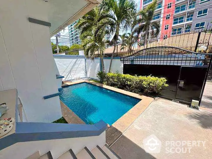 Charming backyard with private pool and lush greenery, perfect for relaxation and entertainment.