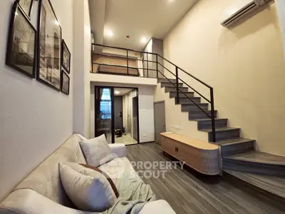 Modern loft apartment with stylish mezzanine and cozy living area, perfect for urban living.