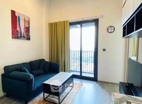 Modern living room with balcony view, stylish decor, and natural light.