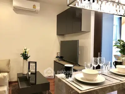 Modern living room with elegant decor and dining setup in a stylish apartment