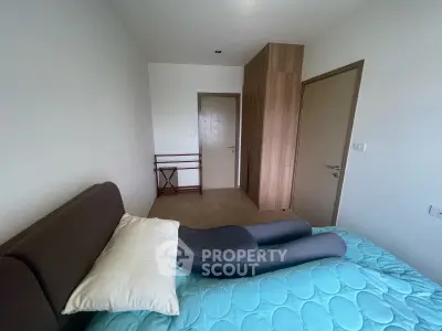 Cozy bedroom with modern design and ample storage space, perfect for relaxation and comfort.