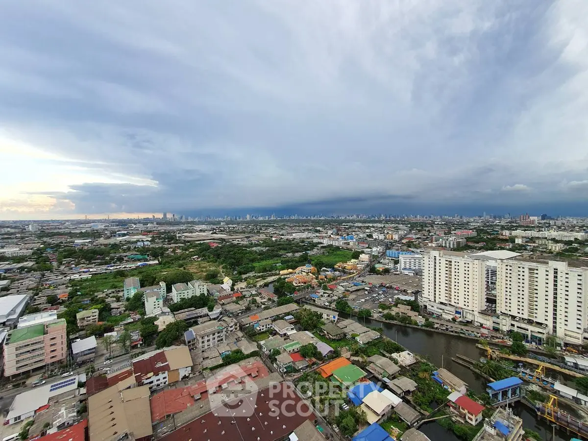 Stunning panoramic cityscape view from high-rise building showcasing urban skyline and vibrant neighborhood.