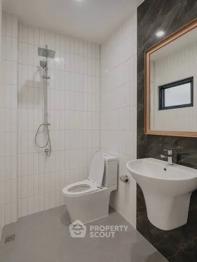 Modern bathroom with sleek fixtures and elegant tile design, perfect for contemporary living.