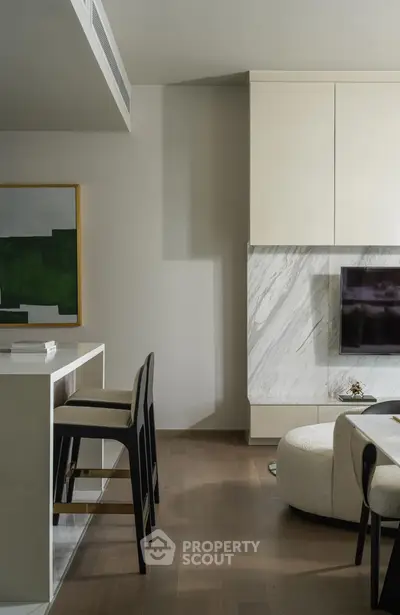 Modern living room with sleek marble accents and stylish furniture