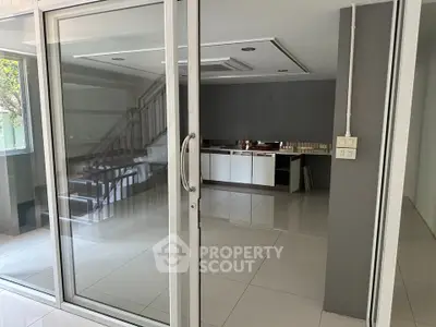 Modern interior with sliding glass doors and sleek kitchen design