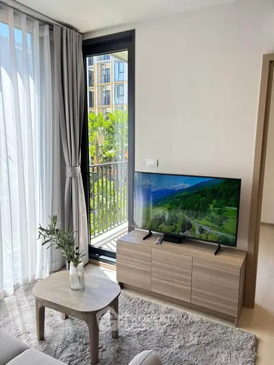 Modern living room with balcony view and stylish furniture