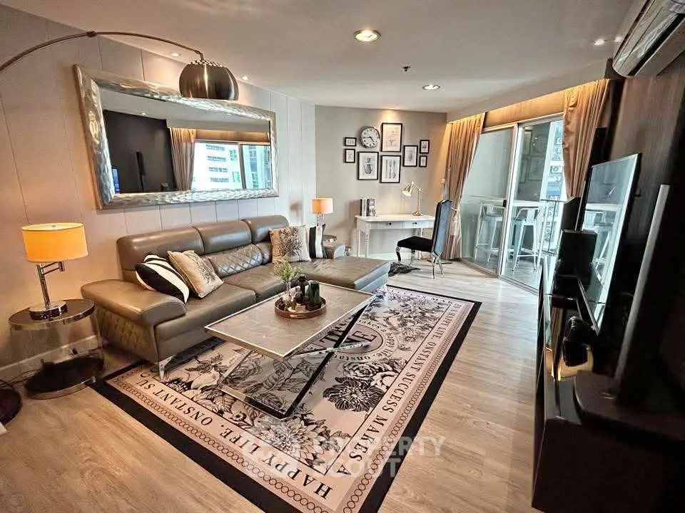 Stylish modern living room with elegant decor and large windows offering city views.