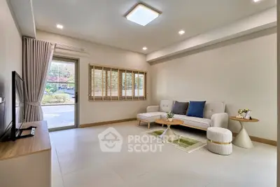Spacious modern living room with natural light and stylish decor