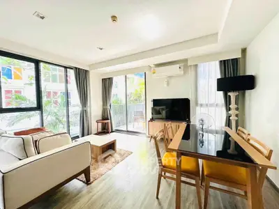 Bright and modern living room with large windows and stylish furniture