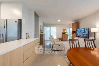 Spacious modern living room with open kitchen and elegant decor