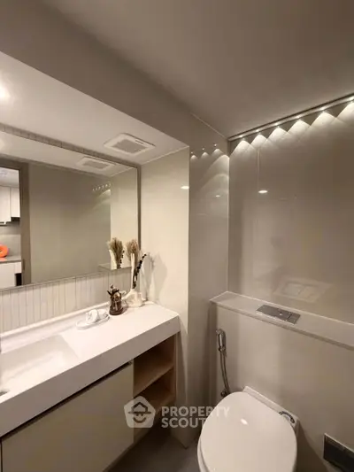 Modern bathroom with sleek fixtures and elegant lighting
