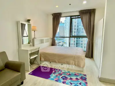 Modern bedroom with city view, featuring stylish decor and ample natural light.