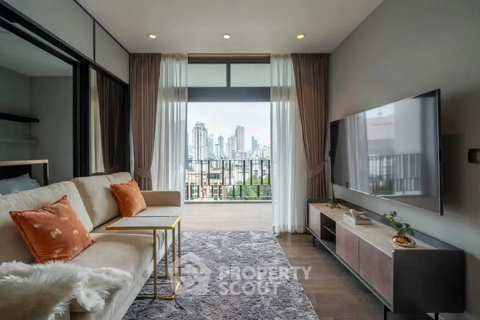 Modern living room with city view, stylish decor, and large balcony access.