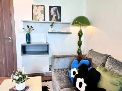 Stylish living room with modern decor, plush sofa, and unique artwork for a cozy ambiance.