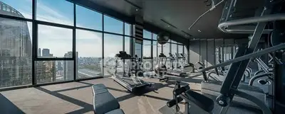 Luxurious high-rise gym with panoramic city views and modern fitness equipment.