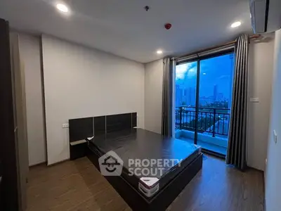 Modern bedroom with balcony view in urban apartment