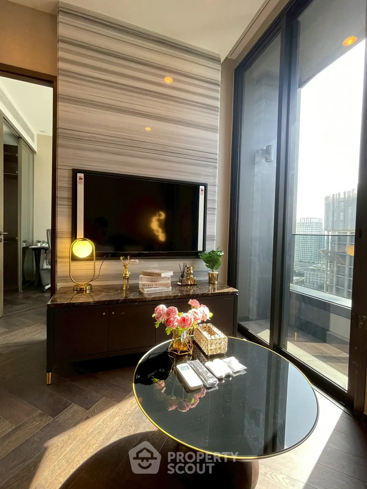 Luxurious living room with modern decor and city view balcony