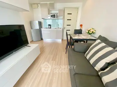 Modern compact living room with open kitchen and stylish decor