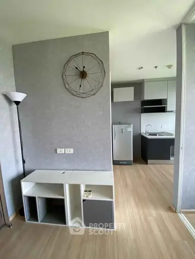 Modern minimalist apartment with compact kitchen and stylish decor
