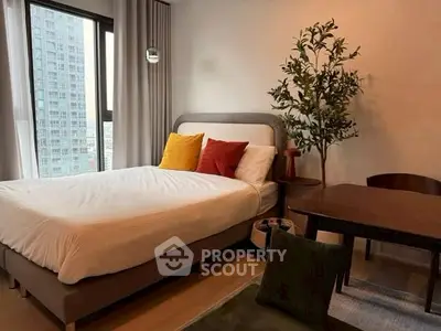 Modern bedroom with city view, stylish decor, and cozy ambiance.
