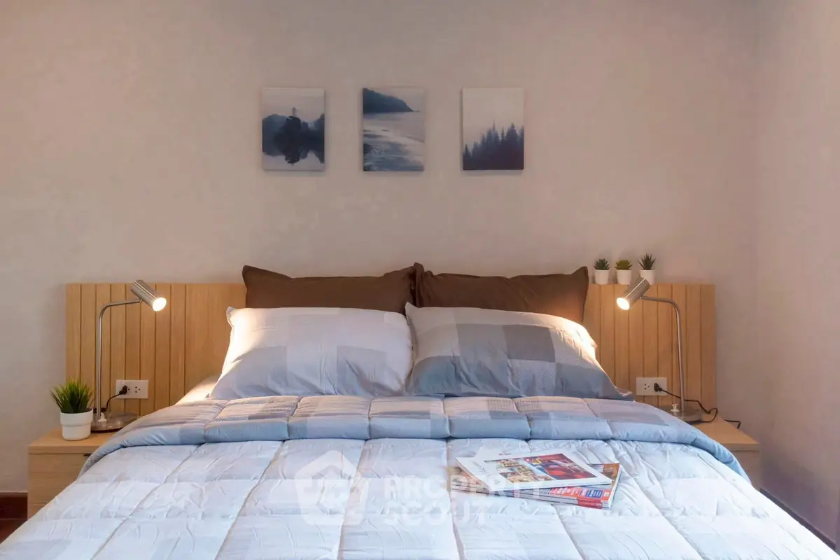 Cozy bedroom with stylish decor and soft lighting, perfect for relaxation.