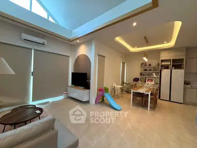 Spacious modern living room with high ceiling and dining area, featuring a playful slide.