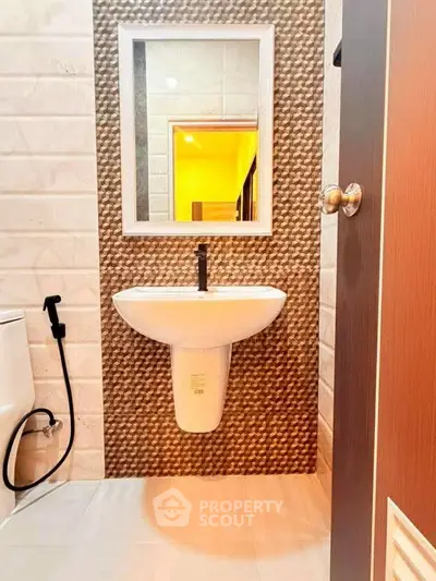 Modern bathroom with stylish sink and textured wall tiles